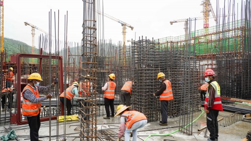 Workers carry out basement constructions.